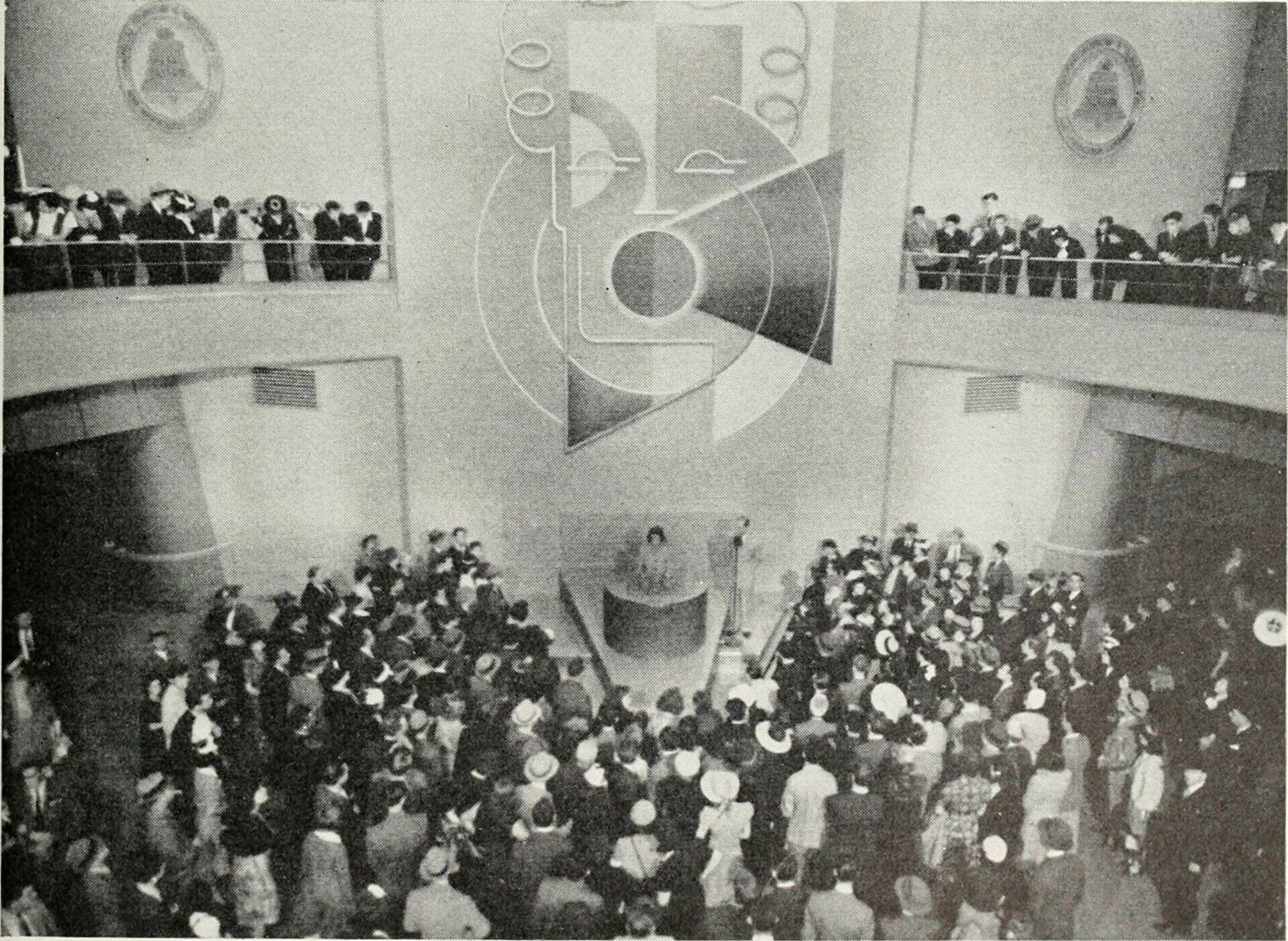 Crowds gather around the Voder, an early electronic speech synthesizer, at the 1939 New York World’s Fair.